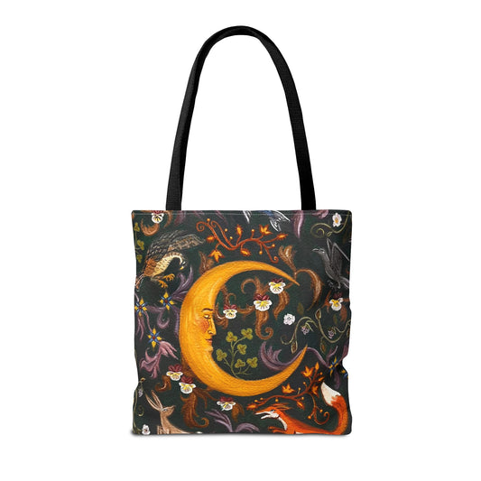Tote bag with a fantasy design featuring a crescent moon, animals, and flowers on a dark green background.