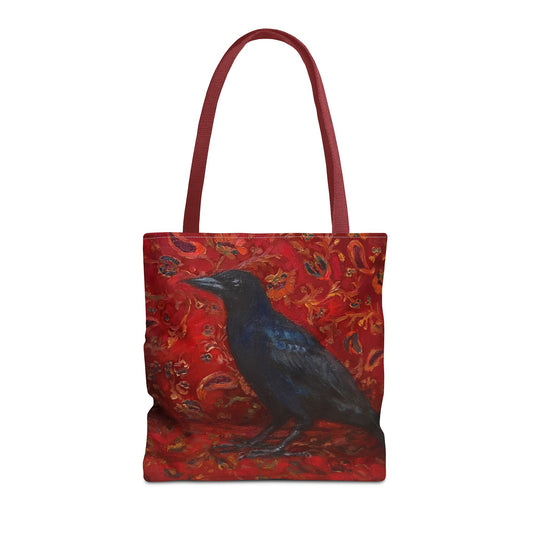 Tote bag with a black bird design on a red background