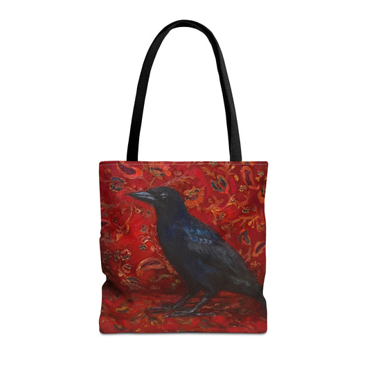 Tote bag with a black crow on a red paisley patterned background