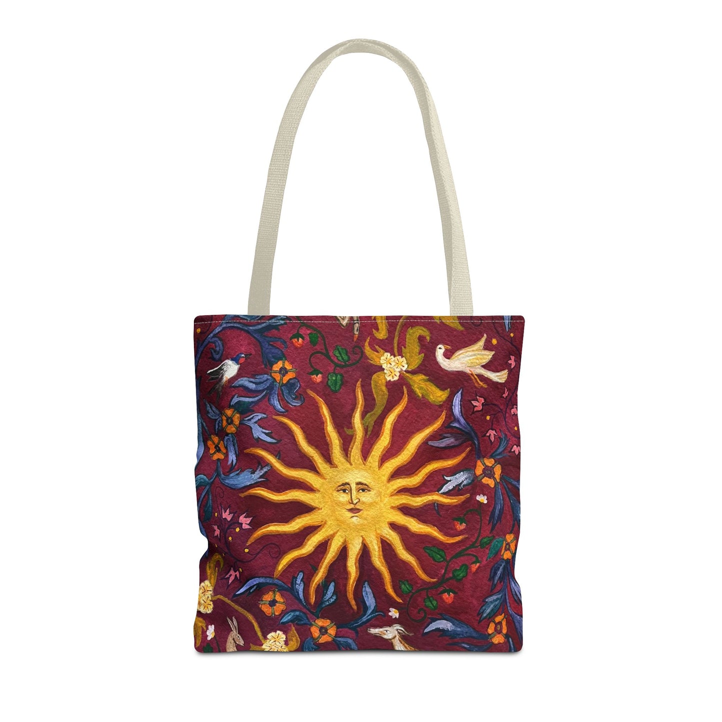 Tote bag with sun and floral design on a red background with black handles
