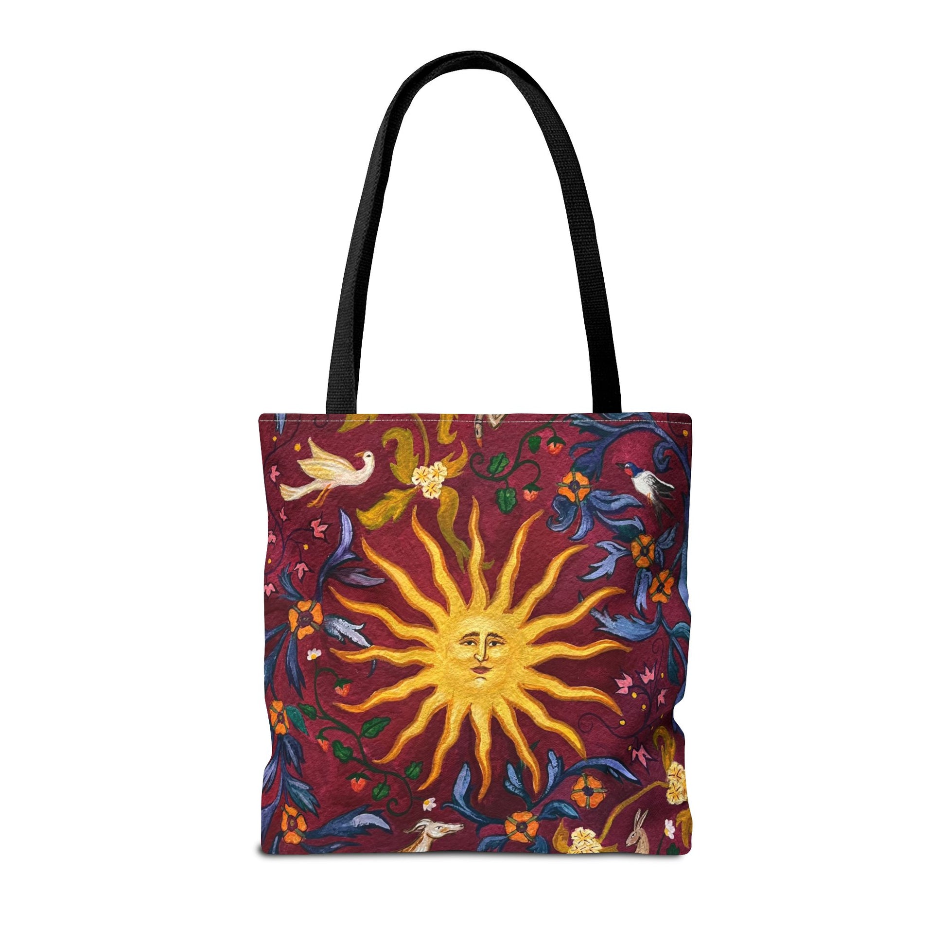 Tote bag with sun and floral design on a red background with black handles