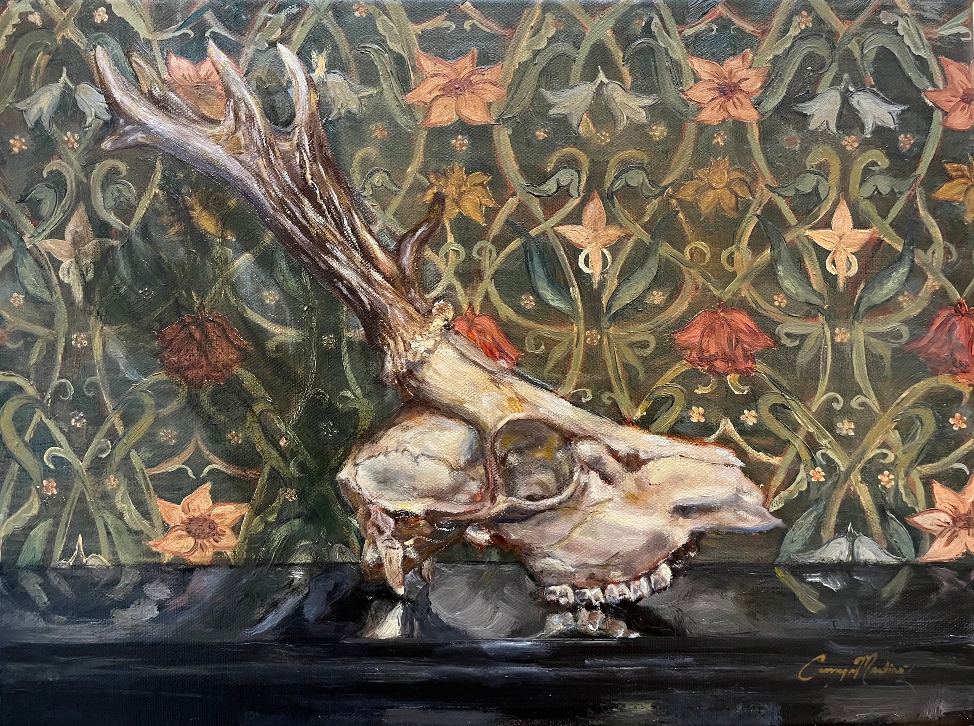 A painting of a deer skull on a floral patterned background